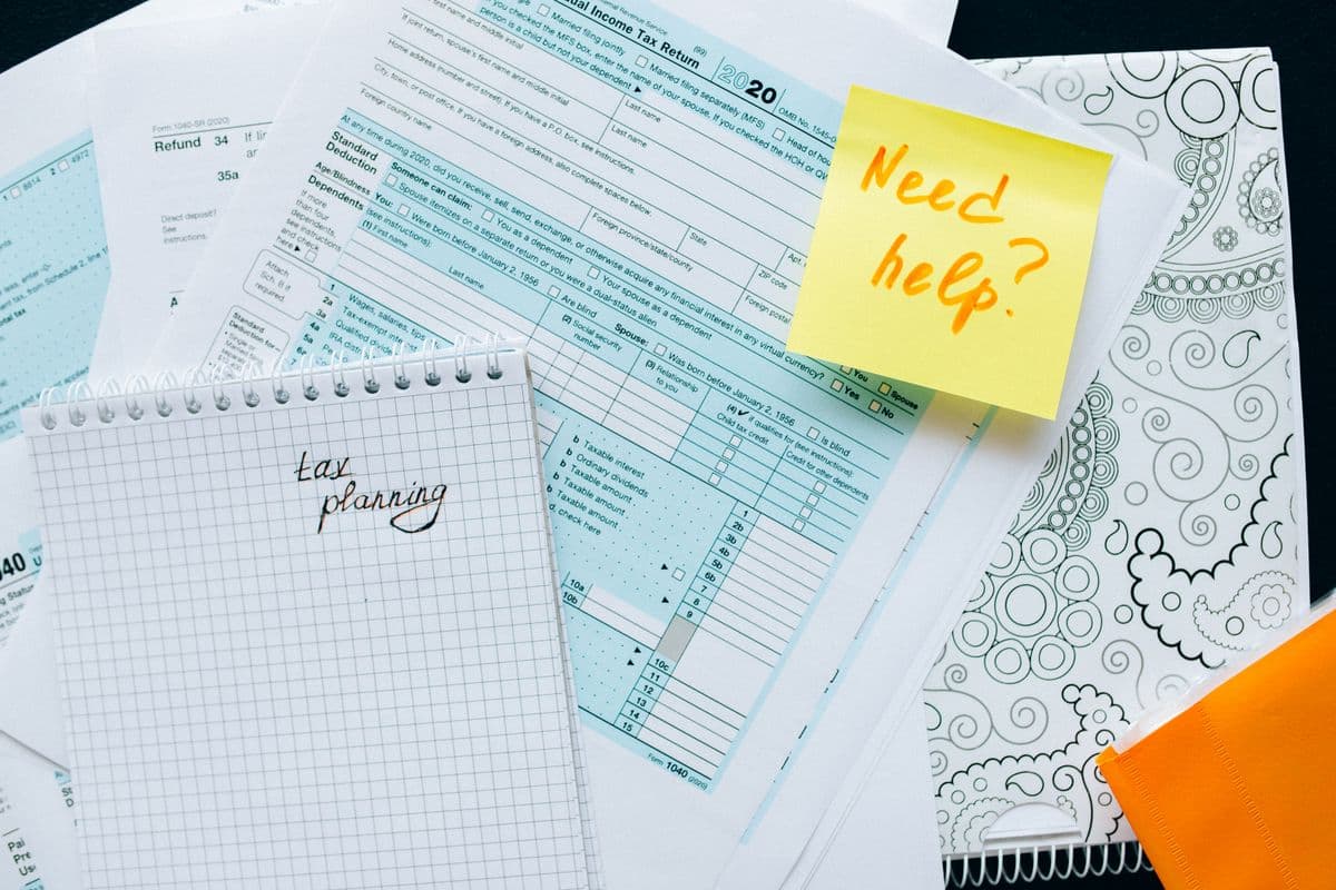 Insurance and billing paperwork with planning notes