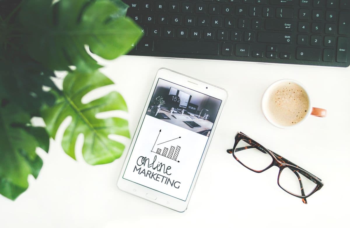 Online marketing analytics on a tablet beside a keyboard