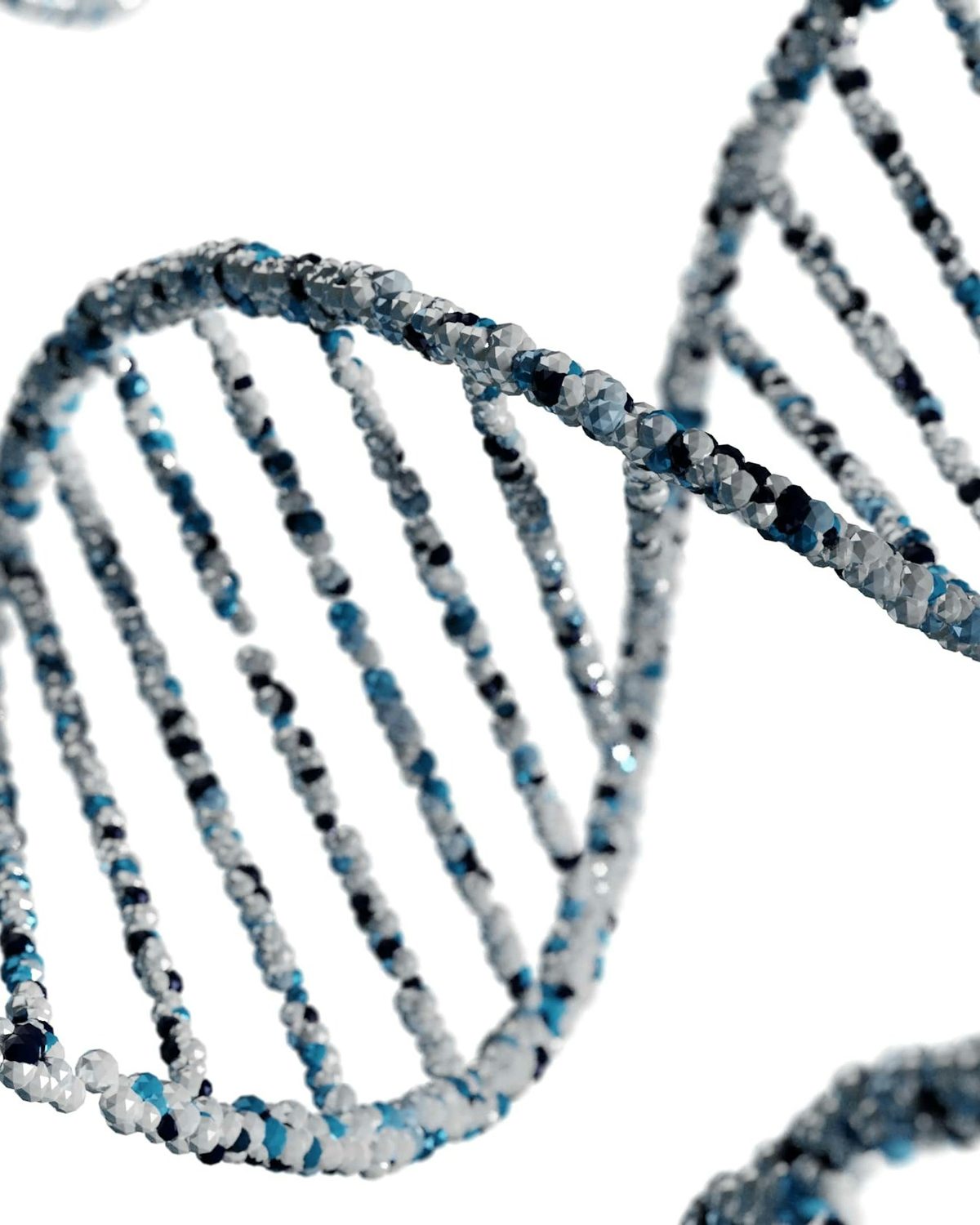 White crystalline double helix on a pale background